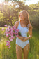 supportive one piece swimsuit for women with built-in underbust elastic and thick adjustable straps.